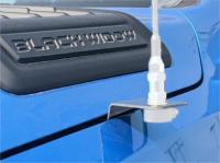 hood seamline view of a fender antenna mount on a dodge ram