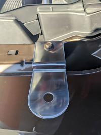 stainless steel antenna mount attached to the fender of a ford bronco