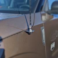 a cb antenna mounted to a ford bronco