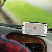 an iphone mounted in a RAM phone holder inside of a vehicle