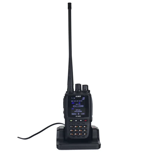 alinco-dj-md5 handheld ham radio sitting in a charging dock