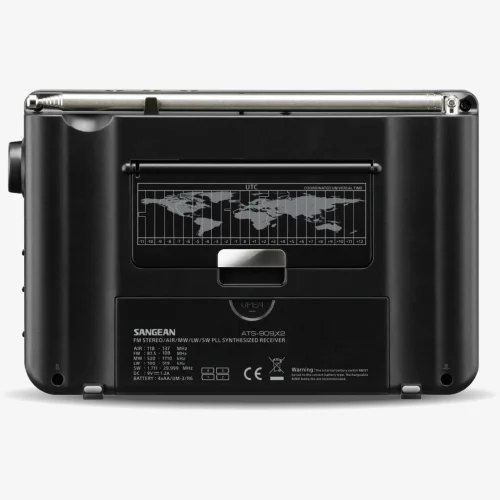 Back of the Sangean ATS-909 showing the battery compartment, pop-out stand, and telescopic antenna