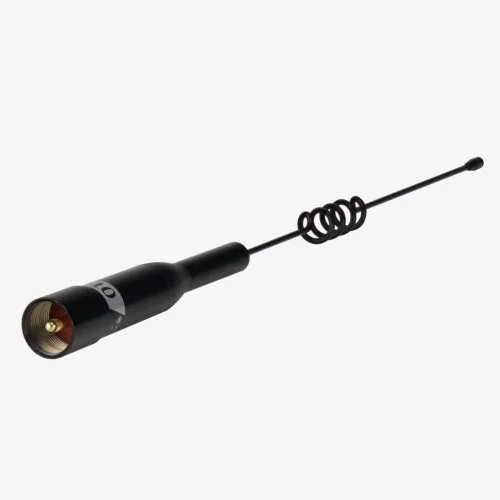 A Comet B-10 dual-band  2m/70cm antenna laying down showing the UHF connection type