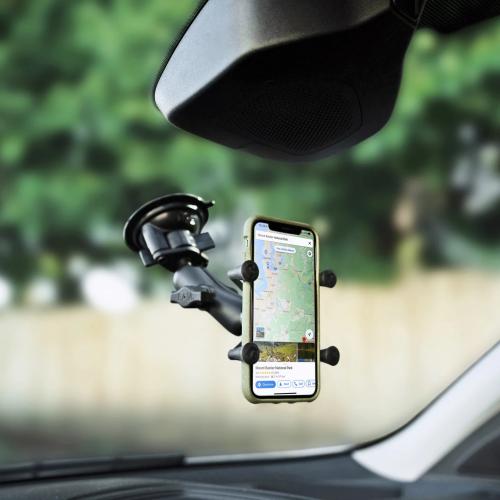 adjustable mount holding samsung cell phone attached to glass with suction cup